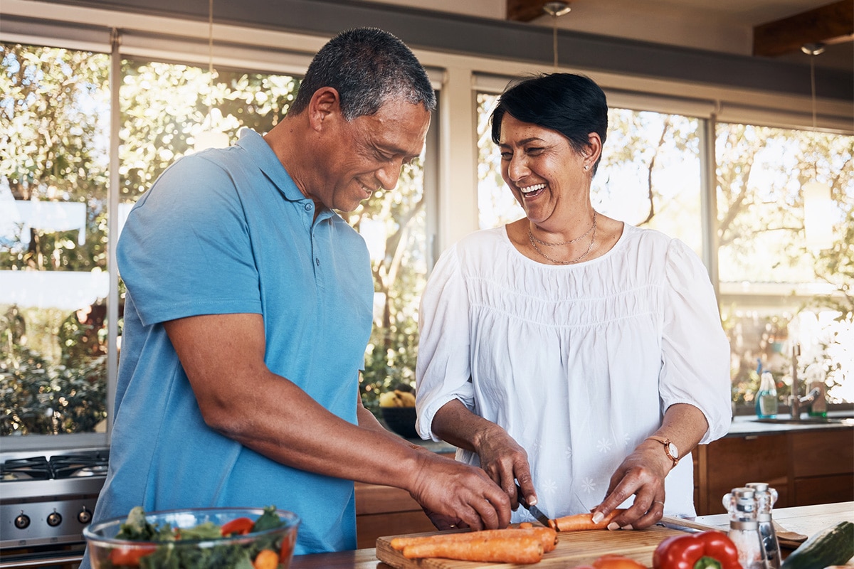 Man With Wife Cooking Food Image